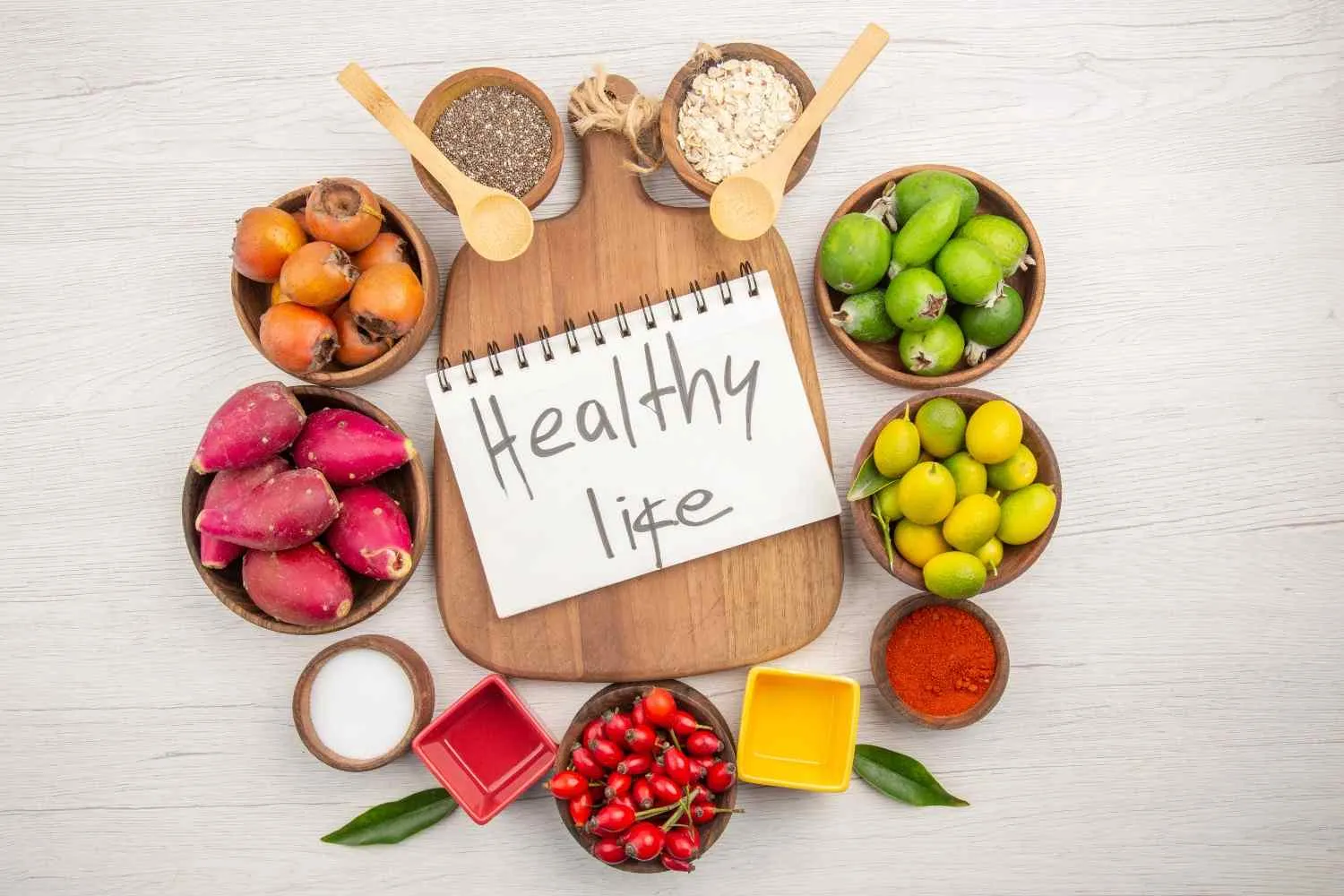 Fresh fruit, seeds and a healthy life note laid out on a table